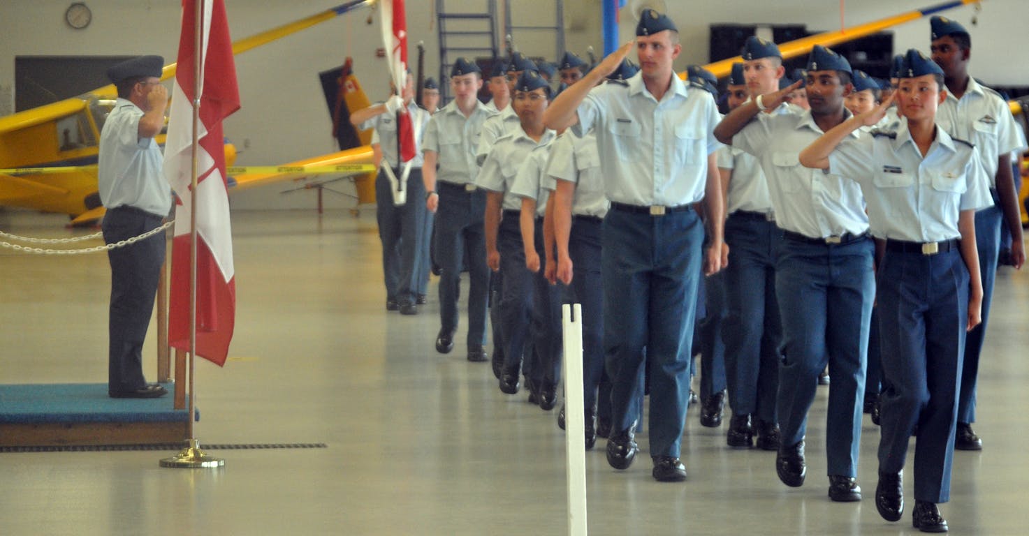 <p>Advancing &#8211; Royal Canadian Air Cadets participating in the Central Region Glider Pilot Scholarship Course march past reviewing officer Lt.-Col. Steve Camps as part of Friday&#8217;s Wings Parade at CFD Mountain View. (Adam Bramburger/Gazette staff)</p>

