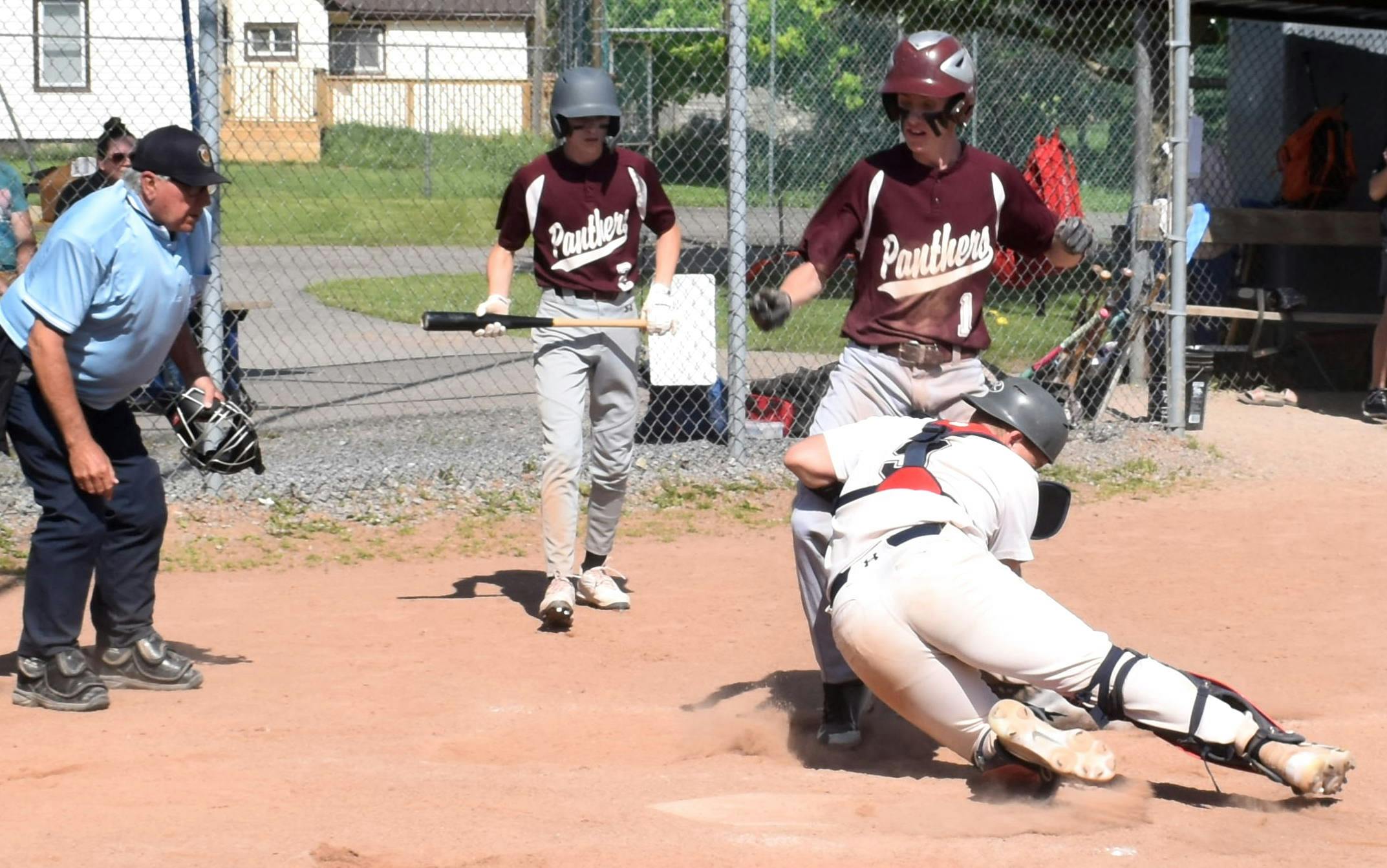 <p>PECI baserunner Cohen Bedore couldn’t avoid the blocking tag of St. Theresa backstop Ben Buxton in the second inning of the 2024 Bay of Quinte Baseball championships in Melrose on Thursday. (Jason Parks/Gazette Staff)</p>
