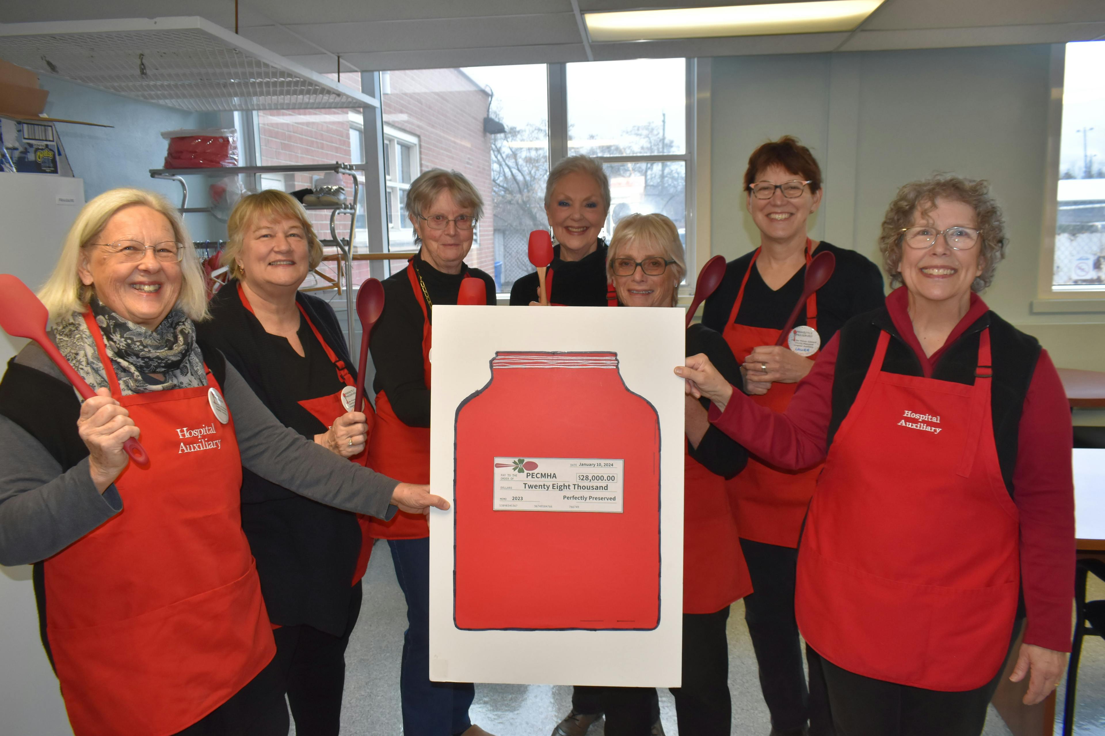 <p>Left to right: Perfectly Preserved members Betty Zyvatkauskas, Rosalind Leslie, Denise Linnett, Dorothy Speirs, Jane Winwood and Laura Bryan present a cheque for $28,000 to Prince Edward County Memorial Hospital Auxiliary past president Cathy Starkey. (Jason Parks/Gazette Staff)</p>
